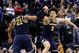 INDIANAPOLIS, IN - MARCH 19: Muhammad-Ali Abdur-Rahkman #12 and D.J. Wilson #5 of the Michigan Wolverines celebrate in the second half against the Louisville Cardinals during the second round of the 2017 NCAA Men's Basketball Tournament at the Bankers Life Fieldhouse on March 19, 2017 in Indianapolis, Indiana. Michigan Wolverines won 73-69. (Photo by Joe Robbins/Getty Images)
