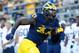 ANN ARBOR, MI - SEPTEMBER 24: Defensive end Taco Charlton #33 of the Michigan Wolverines rushes quarterback Trace McSorley #9 of the Penn State Nittany Lions during the fourth quarter of the game at Michigan Stadium on September 24, 2016 in Ann Arbor, Michigan. Michigan defeated the Penn State 49-10. (Photo by Leon Halip/Getty Images)
