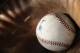 GLENDALE, AZ - FEBRUARY 19: A batting practice baseball rests in a catchers mitt during Chicago White Sox spring training workouts on February 19, 2014 at The Ballpark at Camelback Ranch in Glendale, Arizona. (Photo by Ron Vesely/MLB Photos via Getty Images) ***