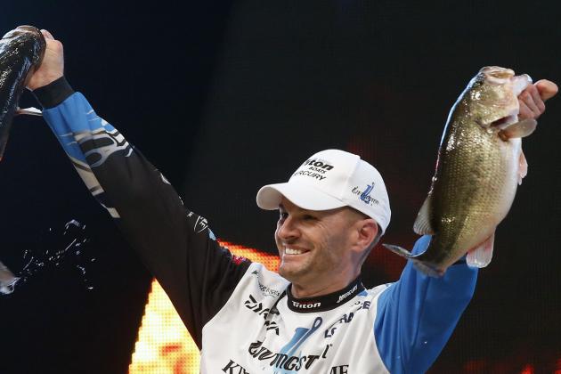 Randy Howell, Springville, Ala., holds up two bass at a weigh-in, Sunday Feb. 23, 2014 in Birmingham, Ala. that helped him win the Bassmaster Classic on Lake Guntersville. (AP Photo/Hal Yeager)