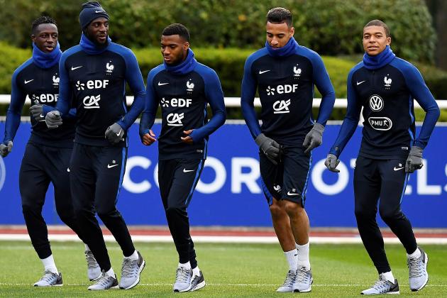 (From L) French national football team's defender Benjamin Mendy, midfielder Tiemoue Bakayoko, midfielder Thomas Lemar, midfielder Corentin Tolisso and forward Kylian Mbappe run during a training session on March 20, 2017, in Clairefontaine near Paris as part of the team's preparation for the upcoming World Cup 2018 qualifiers.   / AFP PHOTO / FRANCK FIFE        (Photo credit should read FRANCK FIFE/AFP/Getty Images)
