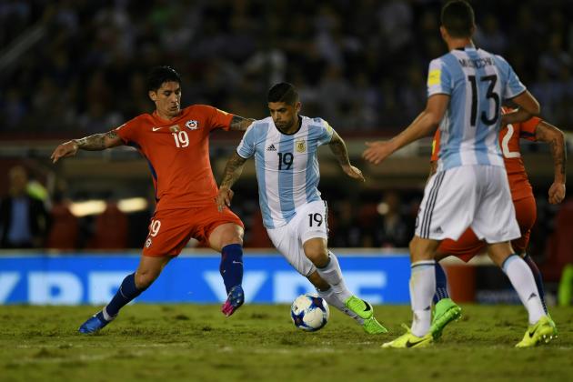 Chile's Pedro Hernandez (L) and Argentina's Ever Banega vie for the ball during their 2018 FIFA World Cup qualifier football match at the Monumental stadium in Buenos Aires, Argentina, on March 23, 2017. / AFP PHOTO / EITAN ABRAMOVICH        (Photo credit should read EITAN ABRAMOVICH/AFP/Getty Images)