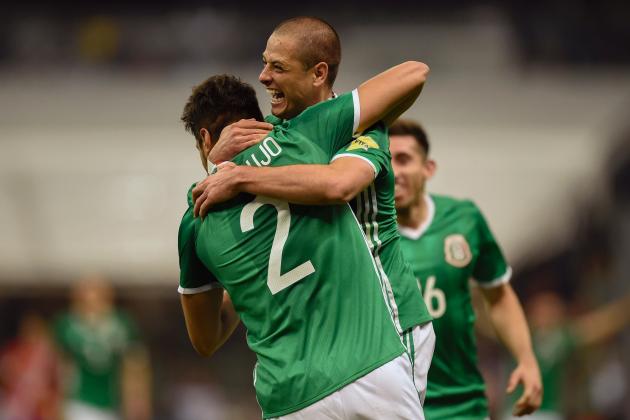 Mexico's forward Javier Hernandez (back) celebrates with teammate Nestor Araujo after scoring against Costa Rica during their 2018 FIFA World Cup qualifier football match in Mexico City on March 24, 2017. / AFP PHOTO / ALFREDO ESTRELLA        (Photo credit should read ALFREDO ESTRELLA/AFP/Getty Images)