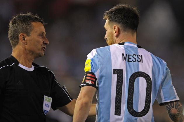 Argentina's forward Lionel Messi (R) argues with Brazilian first assistant referee Emerson Augusto de Carvalho during the half time of their 2018 FIFA World Cup Russia South American qualifier football match against Chile, at the Monumental stadium in Buenos Aires, on March 23, 2017. 
The FIFA on March 28, 2017 suspended Messi for four Argentina games. / AFP PHOTO / ALEJANDRO PAGNI        (Photo credit should read ALEJANDRO PAGNI/AFP/Getty Images)