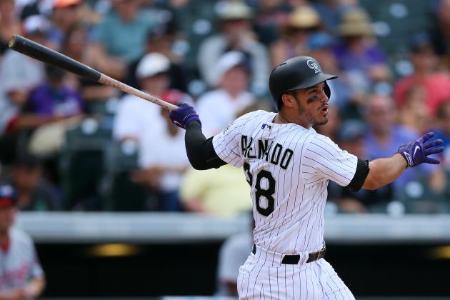 DENVER, CO - AUGUST 17:  Nolan Arenado #28 of the Colorado Rockies watches his RBI sac-fly during the fifth inning against the Washington Nationals at Coors Field on August 17, 2016 in Denver, Colorado. (Photo by Justin Edmonds/Getty Images)