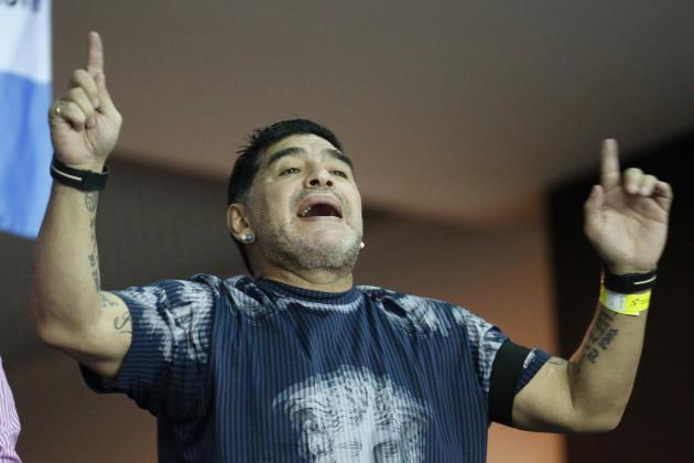 Argentinian soccer legend Diego Maradona cheers from the stands during the Davis Cup finals tennis singles match between Argentina's Juan Martin Del Potro and Croatia's Marin Cilic in Zagreb, Croatia, Sunday, Nov. 27, 2016. (AP Photo/Darko Bandic)
