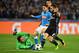 Napoli's forward from Belgium Dries Mertens (C) tries to score against Real Madrid's defender Dani Carvajal (R) and Real Madrid's Costa Rican goalkeeper Keylor Navas during the UEFA Champions League football match SSC Napoli vs Real Madrid on March 7, 2017 at the San Paolo stadium in Naples. / AFP PHOTO / Alberto PIZZOLI (Photo credit should read ALBERTO PIZZOLI/AFP/Getty Images)
