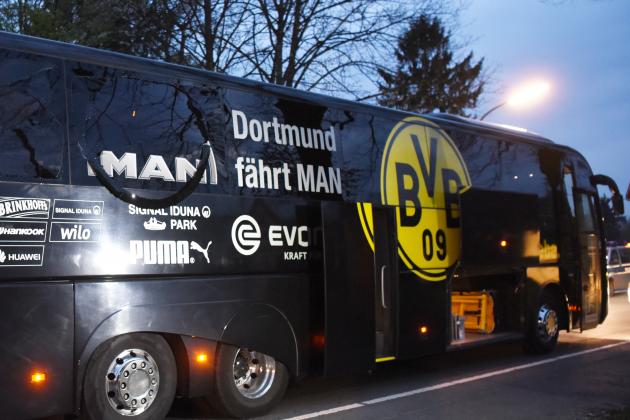 Borussia Dortmund's damaged bus is pictured after an explosion some 10km away from the stadium prior to the UEFA Champions League 1st leg quarter-final football match BVB Borussia Dortmund v Monaco in Dortmund, western Germany on April 11, 2017. / AFP PHOTO / Patrik STOLLARZ        (Photo credit should read PATRIK STOLLARZ/AFP/Getty Images)
