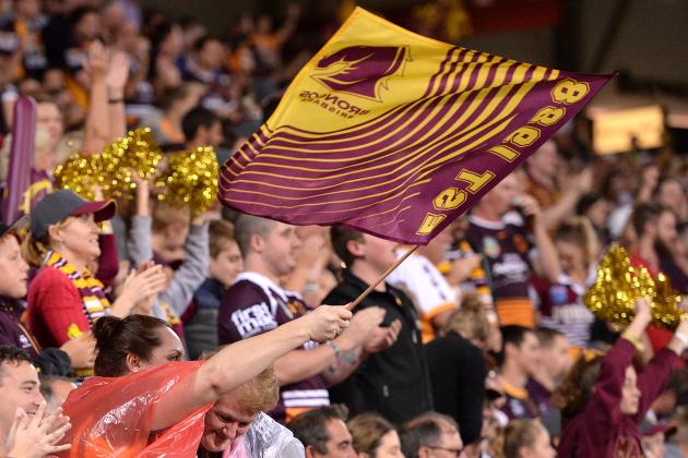 BRISBANE, AUSTRALIA - APRIL 06:  Broncos fans celebrate after a try during the round six NRL match between the Brisbane Broncos and the Sydney Roosters at Suncorp Stadium on April 6, 2017 in Brisbane, Australia.  (Photo by Bradley Kanaris/Getty Images)