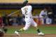 OAKLAND, CA - APRIL 03: Khris Davis #2 of the Oakland Athletics swings and watches the flight of his ball as he hits a solo home run against the Los Angeles Angels of Anaheim in the bottom of the eighth inning at the Oakland-Alameda County Coliseum on April 3, 2017 in Oakland, California. The home run was Davis's second of the game. (Photo by Thearon W. Henderson/Getty Images)