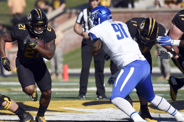 Missouri running back Ish Witter, left, runs with the ball as Middle Tennessee defensive end Justin Akins defends during the first half of an NCAA college football game Saturday, Oct. 22, 2016, in Columbia, Mo. (AP Photo/L.G. Patterson)