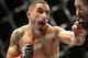 Robert Whittaker, left, hits Rafael Natal during a middleweight mixed martial arts bout at UFC 197, Saturday, April 23, 2016, in Las Vegas. (AP Photo/John Locher)