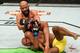 KANSAS CITY, MO - APRIL 15: (L-R) Demetrious Johnson attempts to Wilson Reis of Brazil in their UFC flyweight fight during the UFC Fight Night event at Sprint Center on April 15, 2017 in Kansas City, Missouri. (Photo by Josh Hedges/Zuffa LLC/Zuffa LLC via Getty Images)