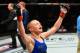 KANSAS CITY, MO - APRIL 15: Rose Namajunas celebrates her submission victory over Michelle Waterson in their women's strawweight fight during the UFC Fight Night event at Sprint Center on April 15, 2017 in Kansas City, Missouri. (Photo by Josh Hedges/Zuffa LLC/Zuffa LLC via Getty Images)