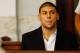 NORTH ATTLEBORO, MA - AUGUST 22: Aaron Hernandez sits in the courtroom of the Attleboro District Court during his hearing on August 22, 2013 in North Attleboro, Massachusetts. Former New England Patriot Aaron Hernandez has been indicted on a first-degree murder charge for the death of Odin Lloyd. (Photo by Jared Wickerham/Getty Images)
