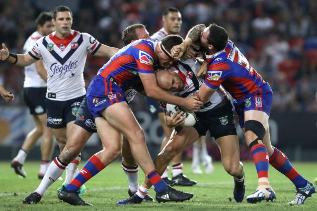 NEWCASTLE, AUSTRALIA - APRIL 14:  Blake Ferguson of the Roosters is tackled by the Knights defence during the round seven NRL match between the Newcastle Knights and the Sydney Roosters at McDonald Jones Stadium on April 14, 2017 in Newcastle, Australia.  (Photo by Tony Feder/Getty Images)