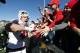 Wisconsin linebacker T.J. Watt, left, celebrates with fans after an NCAA college football game against Iowa, Saturday, Oct. 22, 2016, in Iowa City, Iowa. Wisconsin won 17-9. (AP Photo/Charlie Neibergall)