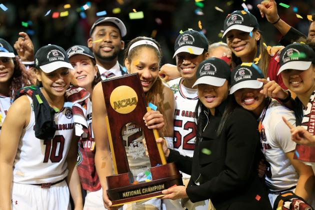 DALLAS, TX - APRIL 02:  A'ja Wilson #22 and head coach Dawn Staley of the South Carolina Gamecocks hold the NCAA trophy and celebrates with their team after winning the championship game against the Mississippi State Lady Bulldogs of the 2017 NCAA Women's Final Four at American Airlines Center on April 2, 2017 in Dallas, Texas.  (Photo by Ron Jenkins/Getty Images)