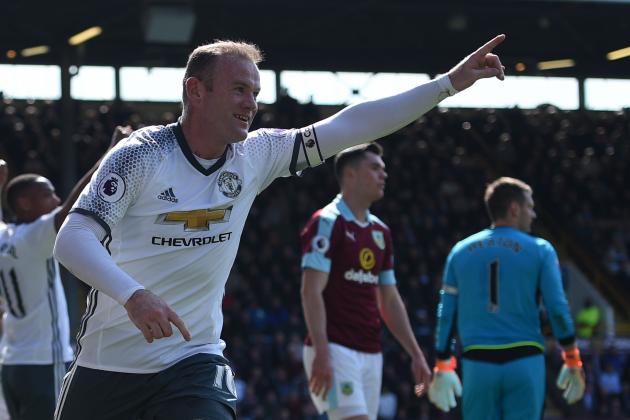 Manchester United's English striker Wayne Rooney (C) celebrates after scoring during the English Premier League football match between Burnley and Manchester United at Turf Moor in Burnley, north west England on April 23, 2017. / AFP PHOTO / Oli SCARFF / RESTRICTED TO EDITORIAL USE. No use with unauthorized audio, video, data, fixture lists, club/league logos or 'live' services. Online in-match use limited to 75 images, no video emulation. No use in betting, games or single club/league/player publications.  /         (Photo credit should read OLI SCARFF/AFP/Getty Images)