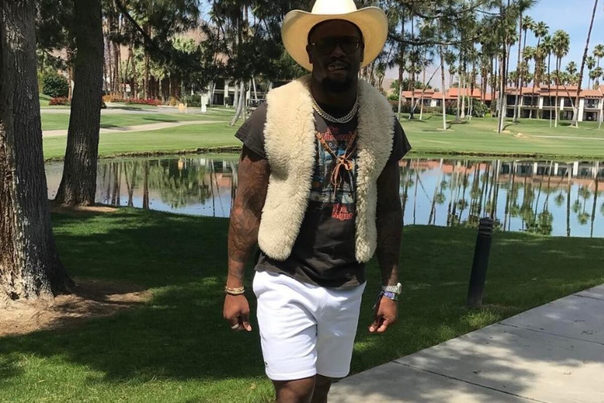 Von Miller Rocks Fur Vest, Cowboy Hat and Bandana at Coachella Music