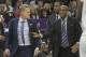 Steve Kerr, left, is held back from a referee by Warriors assistant coach Mike Brown, right, in a regular season game. With Kerr out indefinitely, can Brown have the same impact as Kerr?