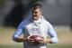 Quarterback Mitch Trubisky waits to pass during North Carolina's pro timing football day in Chapel Hill, N.C., Tuesday, March 21, 2017. (AP Photo/Gerry Broome)