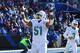 SYRACUSE, NY - NOVEMBER 08: Mike Pouncey #51 of the Miami Dolphins gestures to the crowd prior to the game against the Buffalo Bills at Ralph Wilson Stadium on November 8, 2015 in Orchard Park, New York. Buffalo defeated Miami 33-17. (Photo by Rich Barnes/Getty Images)