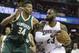 Cleveland Cavaliers' LeBron James (23) drives past Milwaukee Bucks' Giannis Antetokounmpo (34) during the first half of an NBA basketball game, Wednesday, Dec. 21, 2016, in Cleveland. (AP Photo/Tony Dejak)