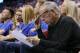 Leslie Alexander, owner of the Houston Rockets, looks over a stat sheet during the third quarter of the team's first-round NBA basketball playoff game against the Oklahoma City Thunder in Oklahoma City, Friday, April 21, 2017. Oklahoma City won 115-113. (AP Photo/Sue Ogrocki)