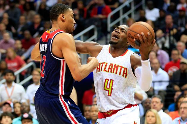 ATLANTA, GA - APRIL 24: Paul Millsap #4 of the Atlanta Hawks is fouled by Otto Porter Jr. #22 of the Washington Wizards during the fourth quarter in Game Four of the Eastern Conference Quarterfinals during the 2017 NBA Playoffs at Philips Arena on April 24, 2017 in Atlanta, Georgia. NOTE TO USER: User expressly acknowledges and agrees that, by downloading and or using the photograph, User is consenting to the terms and conditions of the Getty Images License Agreement. (Photo by Daniel Shirey/Getty Images)