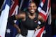 Serena Williams of the US smiles during the awards ceremony after her victory against Venus Williams of the US in the women's singles final on day 13 of the Australian Open tennis tournament in Melbourne on January 28, 2017. / AFP / WILLIAM WEST / IMAGE RESTRICTED TO EDITORIAL USE - STRICTLY NO COMMERCIAL USE (Photo credit should read WILLIAM WEST/AFP/Getty Images)