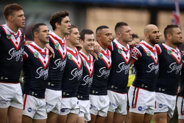 SYDNEY, AUSTRALIA - APRIL 25:  Luke Keary of the Roosters shares a laugh with his team mates as they sing the national anthem during the Anzac Day ceremony before the round eight NRL match between the Sydney Roosters and the St George Illawarra Dragons at Allianz Stadium on April 25, 2017 in Sydney, Australia.  (Photo by Mark Kolbe/Getty Images)