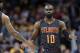 Atlanta Hawks' Tim Hardaway Jr., right, is congratulated by Malcolm Delaney after shooting a three-point basket in the second half of an NBA basketball game against the Cleveland Cavaliers, Friday, April 7, 2017, in Cleveland. (AP Photo/Tony Dejak)