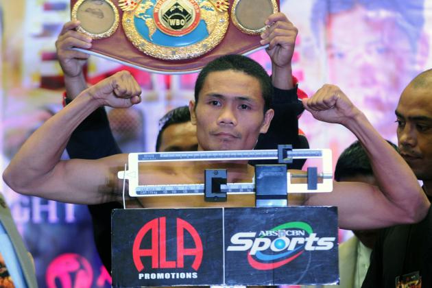 World Boxing Organisation light-flyweight champion Donnie Nietes of the Philippines flexes his muscles at the official weigh-in on June 1, 2012 in Manila. Nietes will stake his title against Mexican challenger Felipe Salguero on June 2. AFP PHOTO / Jay DIRECTO (Photo credit should read JAY DIRECTO/AFP/GettyImages)
