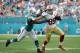 Nov 27, 2016; Miami Gardens, FL, USA; Miami Dolphins outside linebacker Neville Hewitt (46) tackles San Francisco 49ers tight end Vance McDonald (89) during the first half at Hard Rock Stadium. Mandatory Credit: Steve Mitchell-USA TODAY Sports