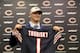 The Chicago Bears' first round draft pick quarterback Mitchell Trubisky, from North Carolina, poses with a Bears' jersey during an NFL football news conference Friday, April 28, 2017, in Lake Forest , Ill. (AP Photo/Charles Rex Arbogast)
