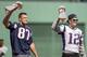 BOSTON, MA - APRIL 3: Tom Brady #12 and Rob Gronkowski #87 of the New England Patriots hold the Super Bowl trophies during a pre-game ceremony before the Boston Red Sox home opener against the Pittsburgh Pirates on April 3, 2017 at Fenway Park in Boston, Massachusetts. (Photo by Billie Weiss/Boston Red Sox/Getty Images)