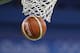A FIBA Rio 2016 basketball goes through the net during the first half of a women's basketball game between Spain and Serbia at the Youth Center at the 2016 Summer Olympics in Rio de Janeiro, Brazil, Sunday, Aug. 7, 2016. (AP Photo/Carlos Osorio)