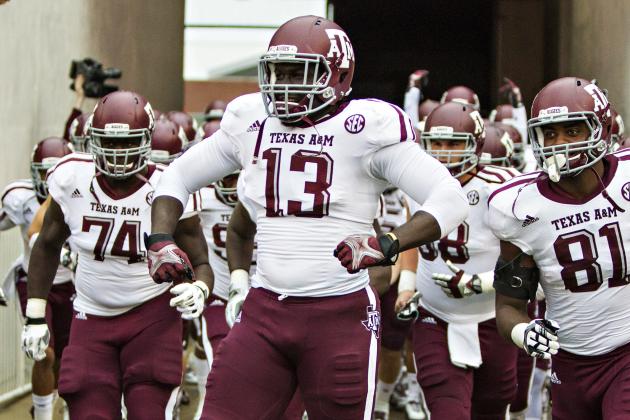 FAYETTEVILLE, AR - SEPTEMBER 28:  Reggie Chevis #13 of the Texas A&M Aggies runs onto the field before a game against the Arkansas Razorbacks at Razorback Stadium on September 28, 2013 in Fayetteville, Arkansas.  The Aggies defeated the Razorbacks 45-33.  (Photo by Wesley Hitt/Getty Images)