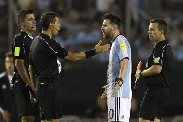 Argentina's forward Lionel Messi (2nd-R) argues with second assistant referee Marcelo Vangasse (2nd-L) next to Brazilian referee Sandro Ricci (L) and first assistant referee Emerson Augusto de Carvalho (R)during the half time of their 2018 FIFA World Cup Russia South American qualifier football match against Chile, at the Monumental stadium in Buenos Aires, on March 23, 2017. 
The FIFA on March 28, 2017 suspended Messi for four Argentina games. / AFP PHOTO / JUAN MABROMATA        (Photo credit should read JUAN MABROMATA/AFP/Getty Images)