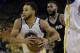 Golden State Warriors guard Stephen Curry drives against the San Antonio Spurs during the first half of Game 1 of the NBA basketball Western Conference finals in Oakland, Calif., Sunday, May 14, 2017. (AP Photo/Jeff Chiu)