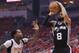 HOUSTON, TX - MAY 11: Patty Mills #8 of the San Antonio Spurs shoots against Patrick Beverley #2 of the Houston Rockets during Game Six of the NBA Western Conference Semi-Finals at Toyota Center on May 11, 2017 in Houston, Texas. NOTE TO USER: User expressly acknowledges and agrees that, by downloading and or using this photograph, User is consenting to the terms and conditions of the Getty Images License Agreement. (Photo by Ronald Martinez/Getty Images)