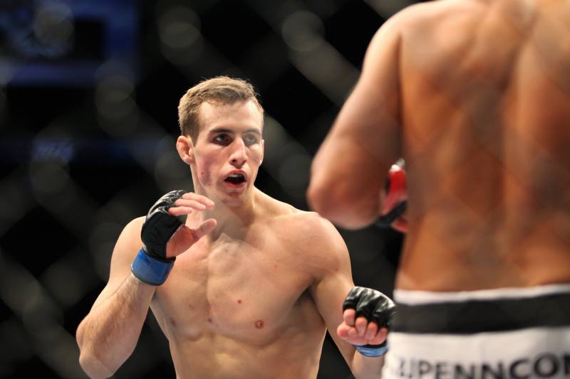 Rory MacDonald, left, in action against BJ Penn during their mixed martial arts bout at a UFC on FOX 5 event in Seattle, Saturday, Dec. 8, 2012. MacDonald won via unanimous decision. (AP Photo/Gregory Payan)