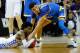 MEMPHIS, TN - MARCH 24: De'Aaron Fox #0 of the Kentucky Wildcats and Lonzo Ball #2 of the UCLA Bruins compete for a lose ball in the second half during the 2017 NCAA Men's Basketball Tournament South Regional at FedExForum on March 24, 2017 in Memphis, Tennessee. (Photo by Kevin C. Cox/Getty Images)