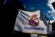 MADRID, SPAIN - JANUARY 31: A Real madrid flag flutters displayed at a merchandaising stall at Estadio Santiago Bernabeu outdoors before the La Liga match between Real Madrid CF and Real Sociedad de Futbol on January 31, 2015 in Madrid, Spain. (Photo by Gonzalo Arroyo Moreno/Getty Images)