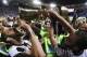Juventus' Leonardo Bonucci drinks from the trophy after winning the Italian Cup soccer final match between Lazio and Juventus, at Rome's Olympic stadium, Wednesday, May 17, 2017. Juventus won 2-0. (AP Photo/Gregorio Borgia)