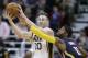 Indiana Pacers forward Paul George (13) attempts to steal the ball from Utah Jazz forward Gordon Hayward (20) during the second half of an NBA basketball game Saturday, Dec. 5, 2015, in Salt Lake City. Utah won 122-119 in overtime. (AP Photo/Rick Bowmer)