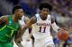 KANSAS CITY, MO - MARCH 25: Josh Jackson #11 of the Kansas Jayhawks dribbles against Jordan Bell #1 of the Oregon Ducks in the first half during the 2017 NCAA Men's Basketball Tournament Midwest Regional at Sprint Center on March 25, 2017 in Kansas City, Missouri. (Photo by Jamie Squire/Getty Images)
