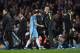 Manchester City's Spanish manager Pep Guardiola (CR) greets Manchester City's German midfielder Ilkay Gundogan (CL) as hee is substituted during the English Premier League football match between Manchester City and Watford at the Etihad Stadium in Manchester, north west England, on December 14, 2016. / AFP / Paul ELLIS / RESTRICTED TO EDITORIAL USE. No use with unauthorized audio, video, data, fixture lists, club/league logos or 'live' services. Online in-match use limited to 75 images, no video emulation. No use in betting, games or single club/league/player publications. / (Photo credit should read PAUL ELLIS/AFP/Getty Images)