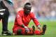 Liverpool's Senegalese midfielder Sadio Mane reacts after picking up an injury during the English Premier League football match between Liverpool and Everton at Anfield in Liverpool, north west England on April 1, 2017. / AFP PHOTO / Paul ELLIS / RESTRICTED TO EDITORIAL USE. No use with unauthorized audio, video, data, fixture lists, club/league logos or 'live' services. Online in-match use limited to 75 images, no video emulation. No use in betting, games or single club/league/player publications. / (Photo credit should read PAUL ELLIS/AFP/Getty Images)